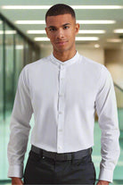 A man wearing a grandad collar shirt